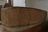 Saint Alkmund's ornately-carved stone sarcophagus in Derby Museum.