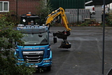 S. Gratton Plant Hire dropping off Komatsu digger at Saint Alkmund's Green - October 2021.