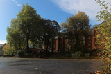 Blue skies and autumn trees at Saint Alkmund's Green, Derby.