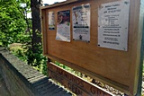 Saint Alkmund's Town Green - Wooden notice board with posters for local Slimming World group and Walkies and Cuddles